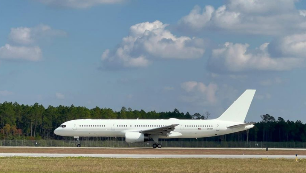 white plane touching base at northwest florida beach airport