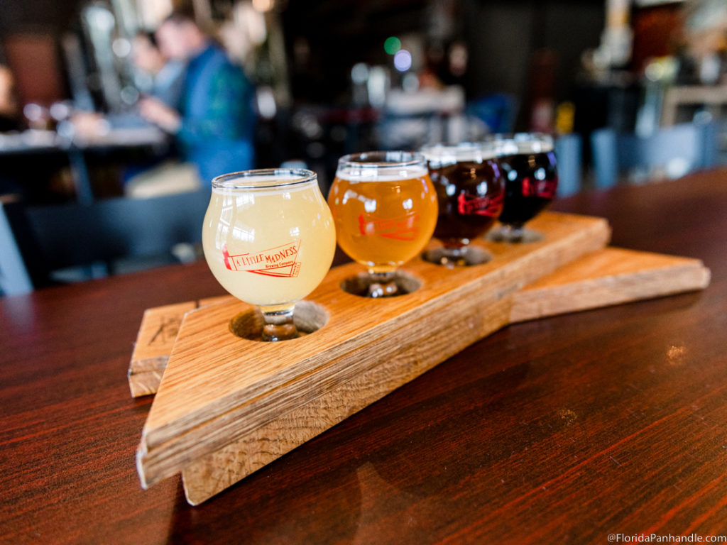 a cool, wooden flight with different colored beer