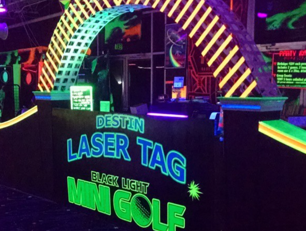 glow in the dark mini golf and laser tag sign and register