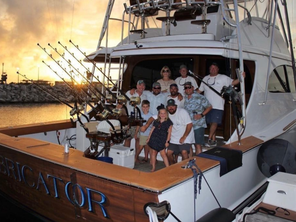 pensacola events, people on a boat smiling